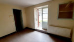 Ensemble immobilier, proche centre ville ESPALION, en pierres, garages, terrain.